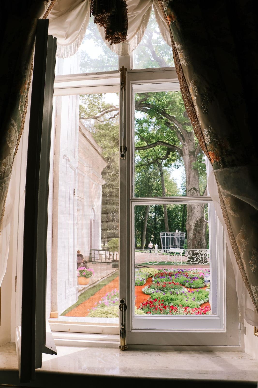 Casement windows in Red Deer: casement window open to a garden